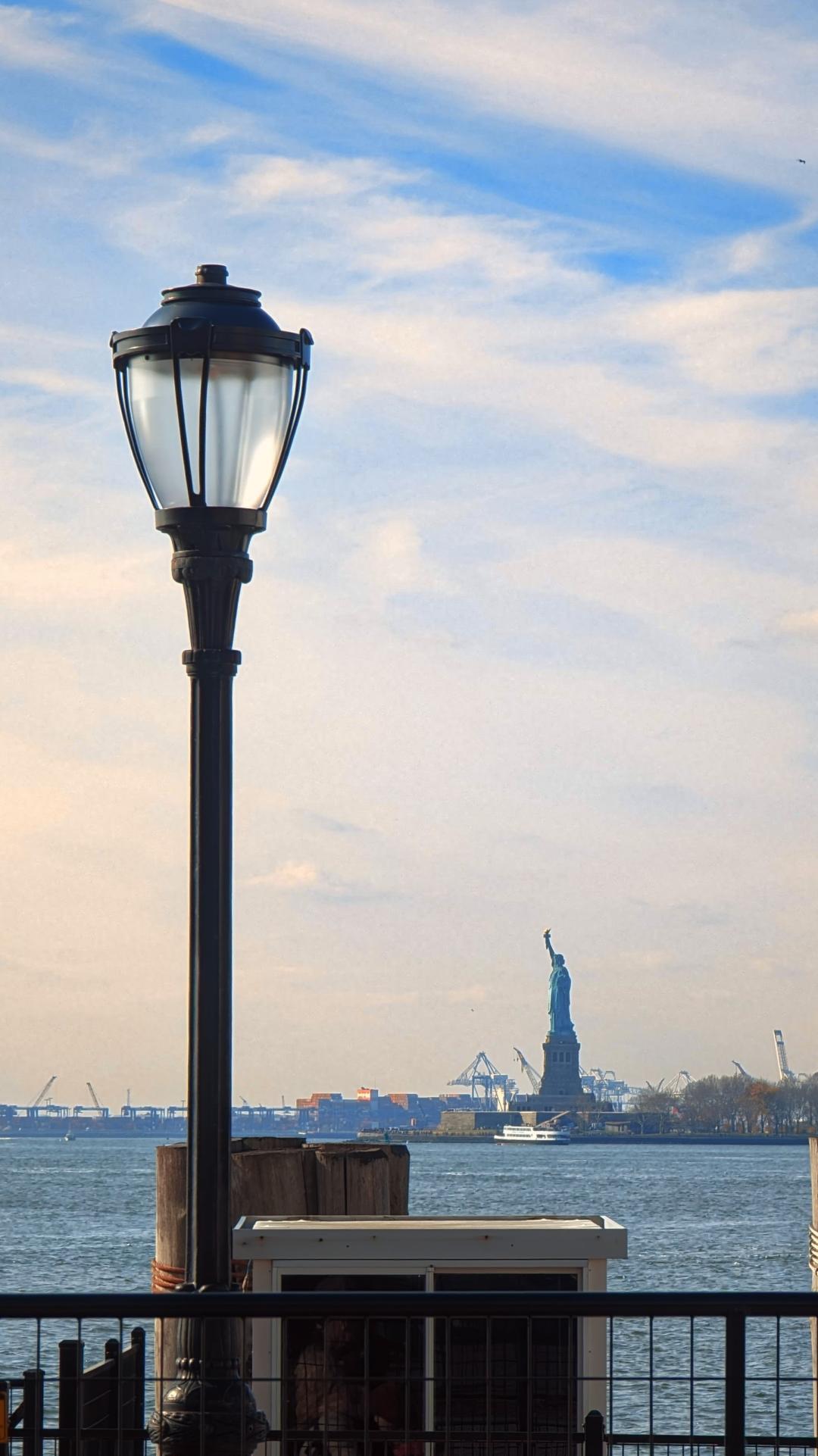 The Statue of Liberty in the distance, viewed from Manhattan