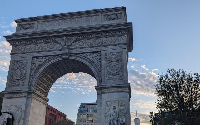 The arch in Washington Square Park NYC with the Freedom Tower in the background