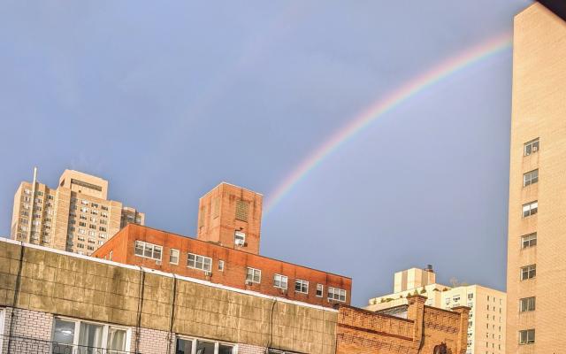 A rainbow over NYC apartment buildings.